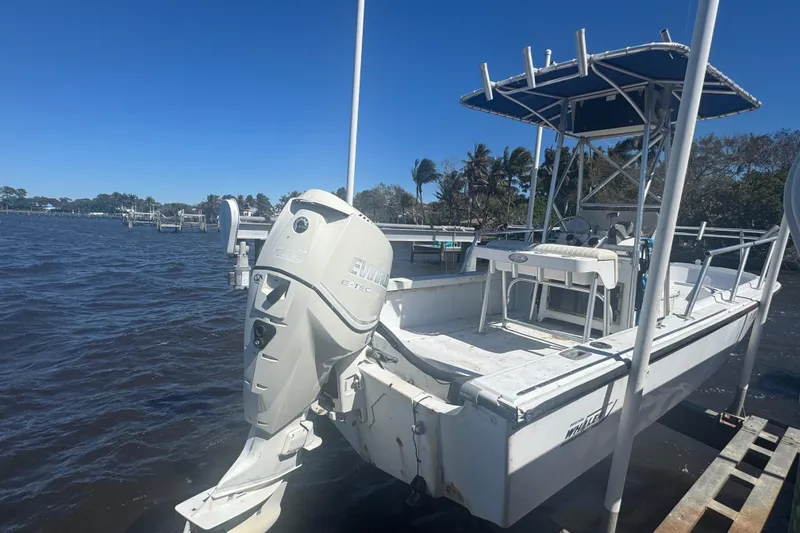Slide: The Image of 1988 Boston Whaler Outrage 17 boat with Evinrude engine on a sunny day. - 20