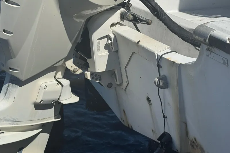 Slide: The Image of 1988 Boston Whaler Outrage 17 boat motor and transom detail. - 26