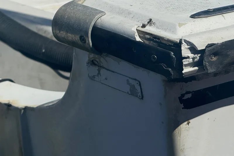 Slide: The Image of Damaged corner of a 1988 Boston Whaler Outrage 17 boat. - 27