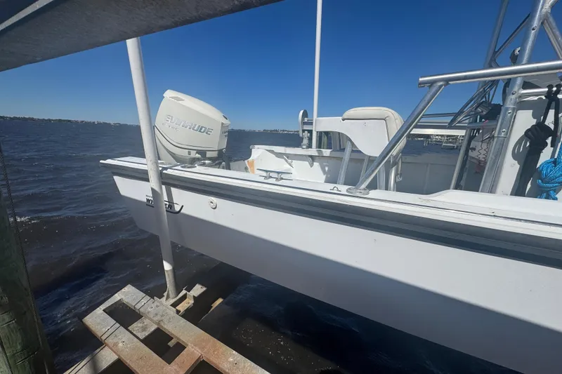 Slide: The Image of 1988 Boston Whaler Outrage 17 boat with Evinrude motor on a sunny day. - 9