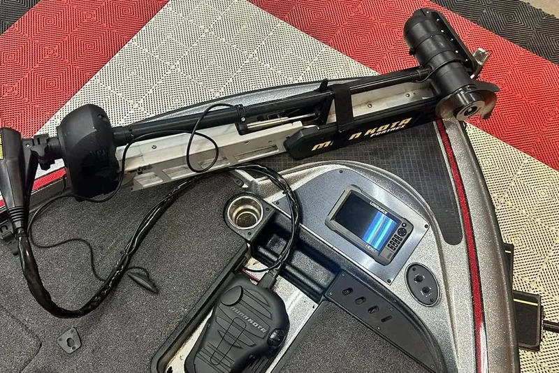 Slide: The Image of 2019 Triton 18 TrX boat deck with trolling motor and fishfinder. - 5