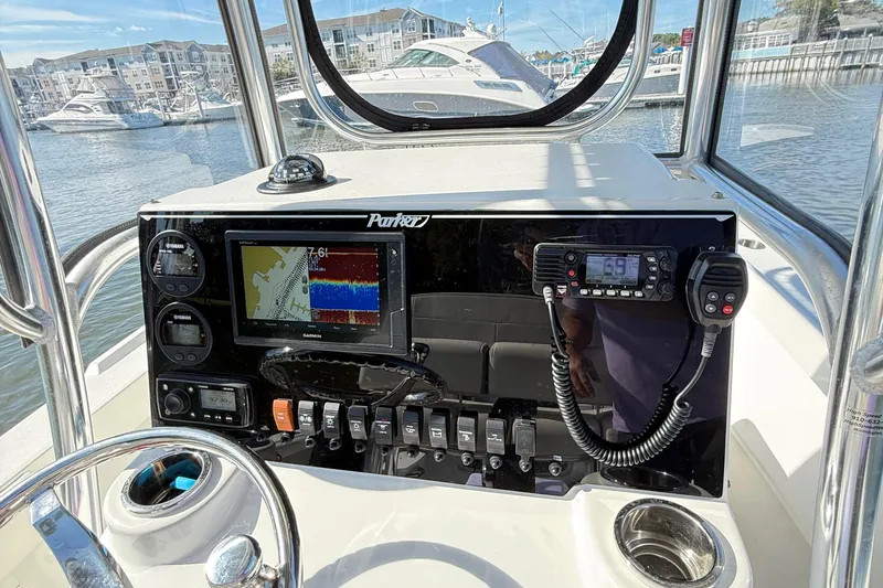 Slide: The Image of 2020 Parker 2100 Special Edition boat dashboard with navigation and communication equipment. - 13