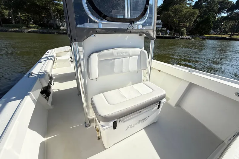 Slide: The Image of 2020 Parker 2100 Special Edition boat interior with cushioned seating and open deck. - 18
