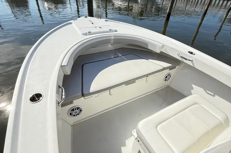 Slide: The Image of 2020 Parker 2100 Special Edition boat interior with cushioned seating and cup holders. - 20