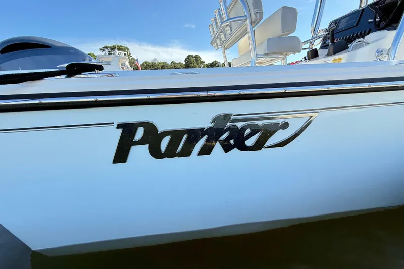 Slide: The Image of 2020 Parker 2100 Special Edition boat with logo, docked under clear blue sky. - 43
