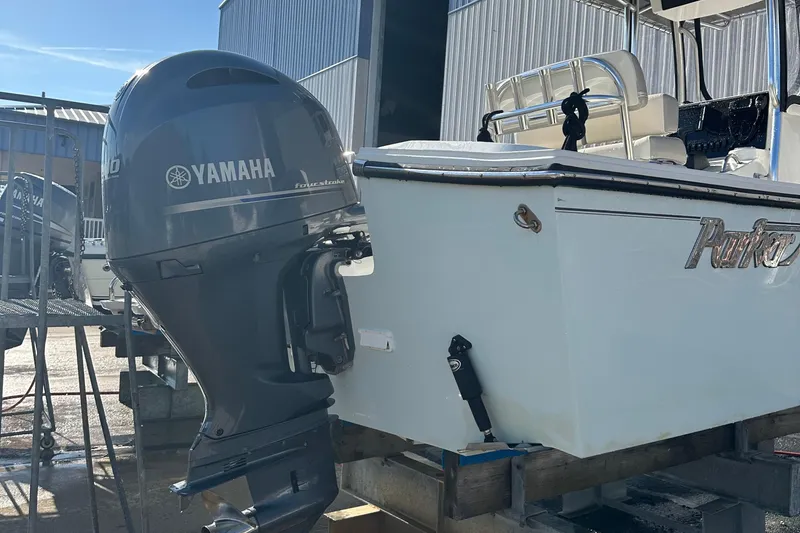 Slide: The Image of 2020 Parker 2100 Special Edition boat with Yamaha outboard motor in a marina setting. - 5