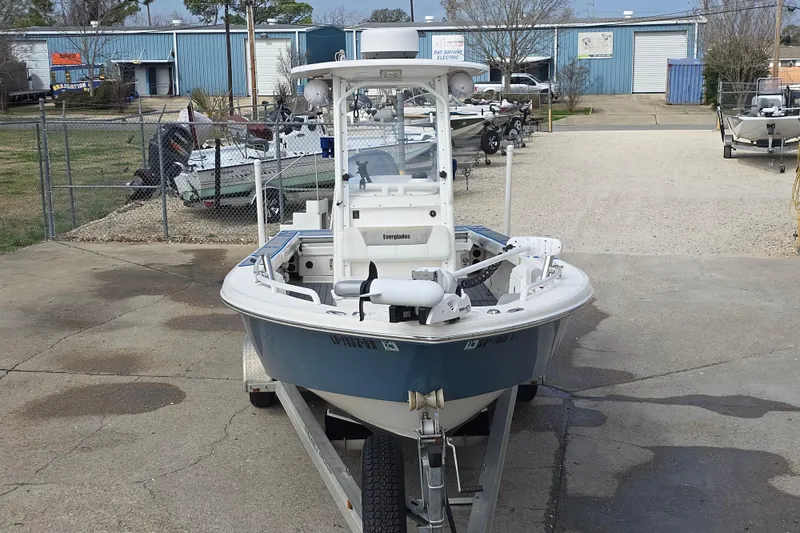 Slide: The Image of 2012 Everglades 243 Center Console boat on trailer in outdoor storage area. - 1