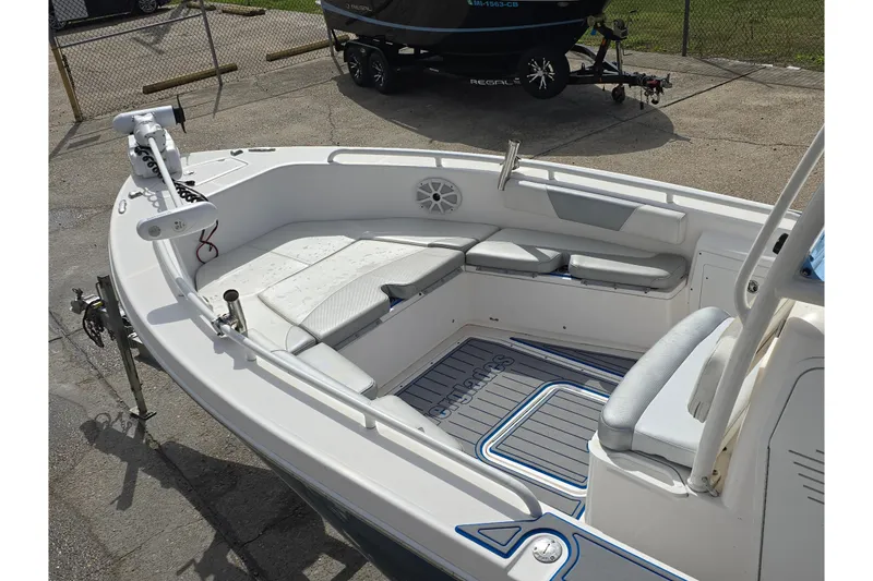 Slide: The Image of 2012 Everglades 243 Center Console boat with spacious seating and modern design. - 10