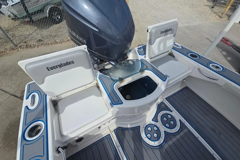 Slide: The Image of 2012 Everglades 243 Center Console boat with Yamaha engine, open storage compartments. - 18