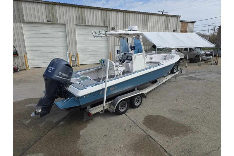 Slide: The Image of 2012 Everglades 243 Center Console boat on trailer, featuring Yamaha 300 engine. - 3