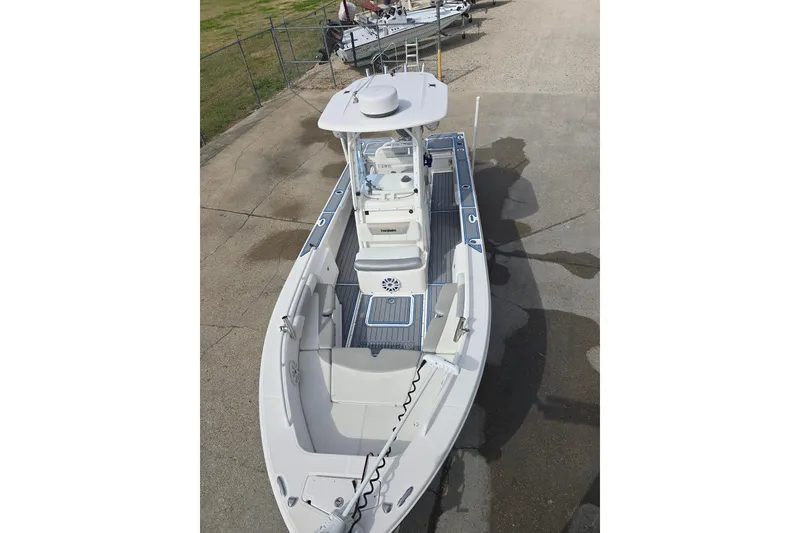 Slide: The Image of 2012 Everglades 243 Center Console boat on a concrete surface, top view. - 8