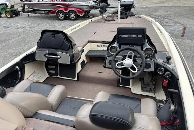 Slide: The Image of 2011 Skeeter FX20 boat interior with steering wheel and Humminbird electronics. - 3