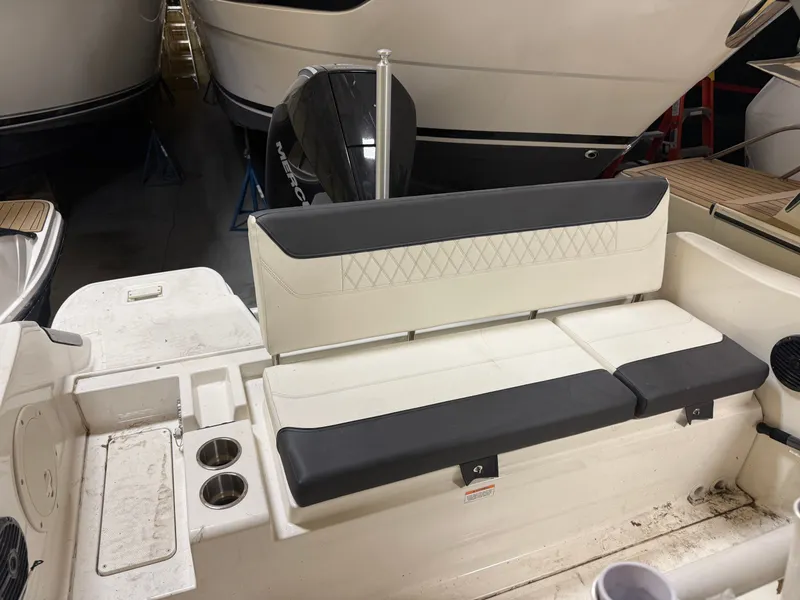 Slide: The Image of Bayliner TROPHY CC24 2023 with seating and motor in background. - 10