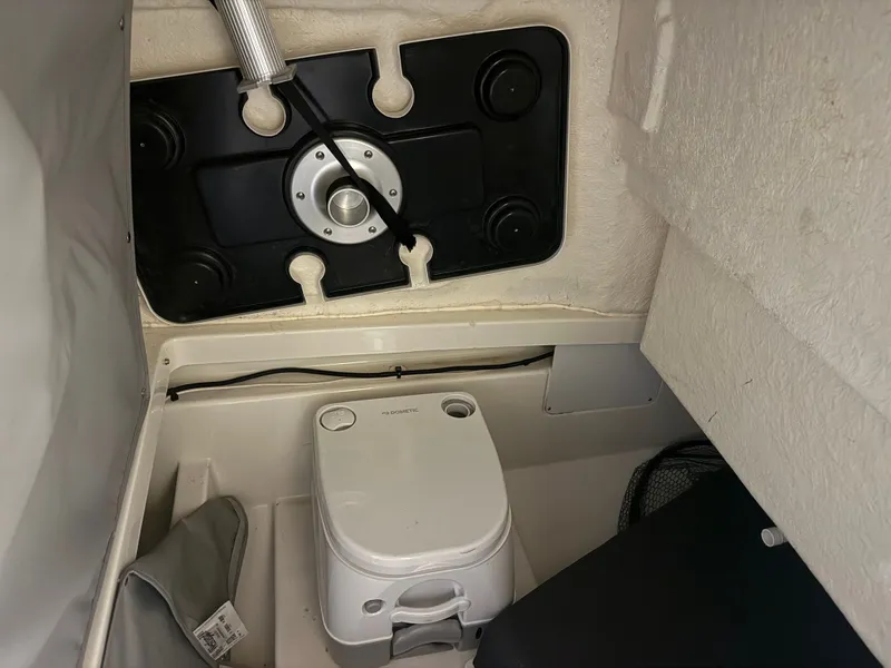 Slide: The Image of Interior of 2023 Bayliner TROPHY CC24 with portable toilet. - 12