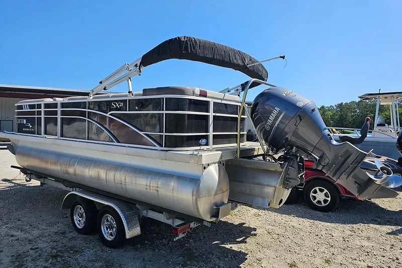 Slide: The Image of 2023 Bennington 21 SLX pontoon boat with Yamaha outboard motor on trailer. - 18