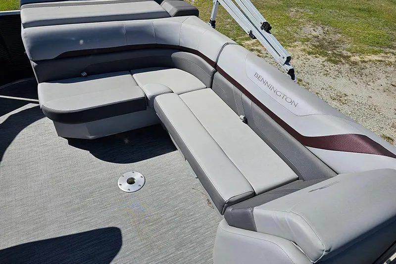 Slide: The Image of 2023 Bennington 21 SLX boat with luxurious gray seating and sleek design. - 22