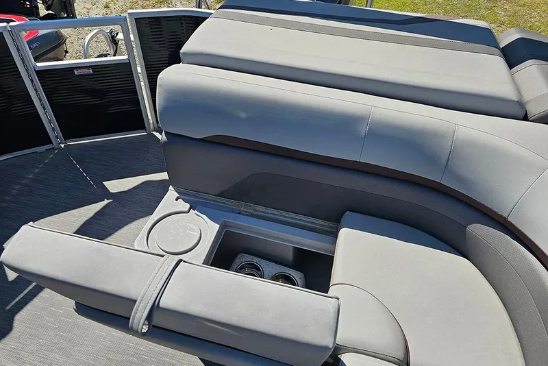 Slide: The Image of 2023 Bennington 21 SLX boat interior with gray seating and cup holders. - 25