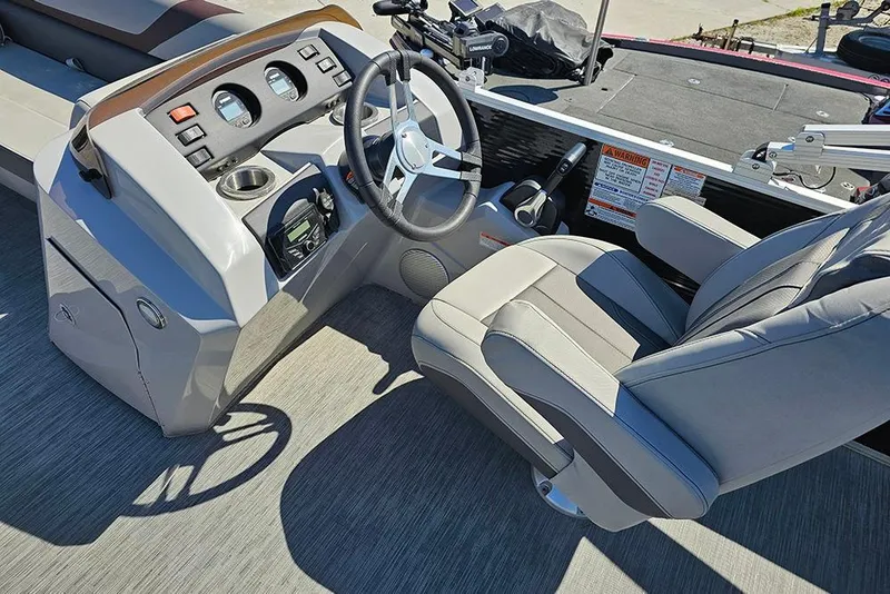 Slide: The Image of 2023 Bennington 21 SLX boat interior with steering wheel and captain's chair. - 26