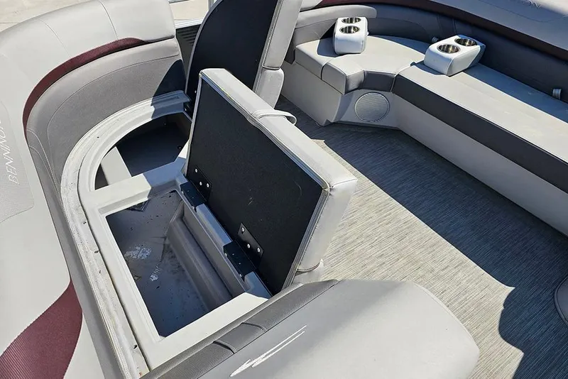 Slide: The Image of Interior of 2023 Bennington 21 SLX pontoon boat with open storage compartment. - 29