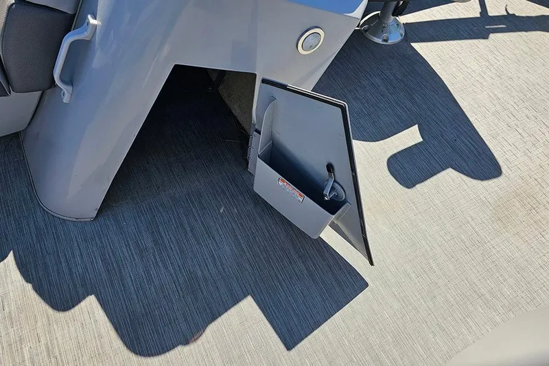 Slide: The Image of 2023 Bennington 21 SLX boat storage compartment with open door on deck. - 31