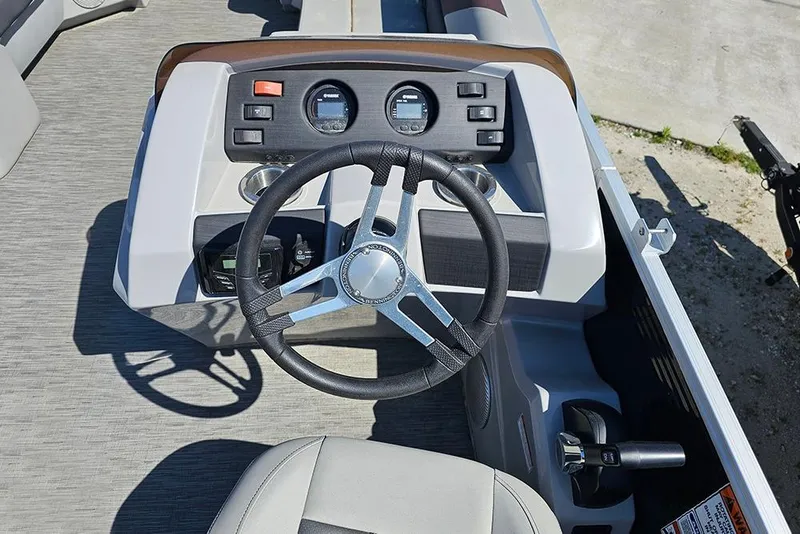 Slide: The Image of Steering console of 2023 Bennington 21 SLX boat with modern controls and gauges. - 32