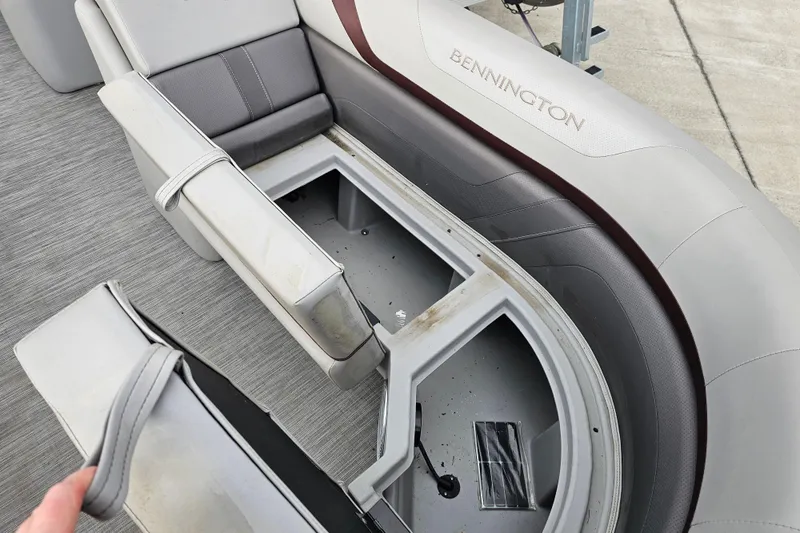 Slide: The Image of 2023 Bennington 21 SLX boat interior with open storage compartment. - 9