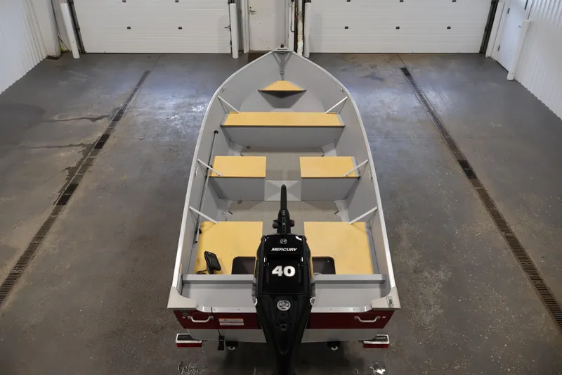 Slide: The Image of 2022 Lund SSV-16 Tiller boat with Mercury 40 engine in a garage. - 10