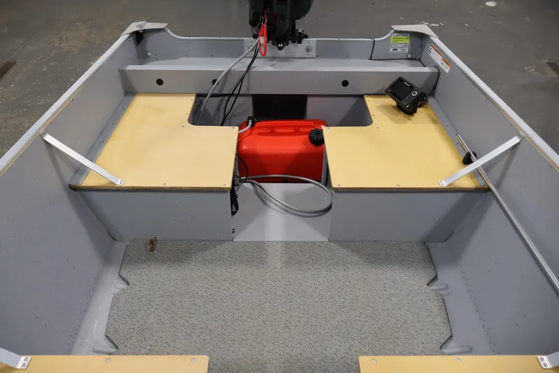 Slide: The Image of 2022 Lund SSV-16 Tiller boat interior with red fuel tank and control panel. - 13