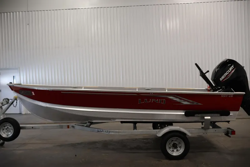 Slide: The Image of 2022 Lund SSV-16 Tiller boat on trailer, red exterior, Mercury outboard motor. - 8