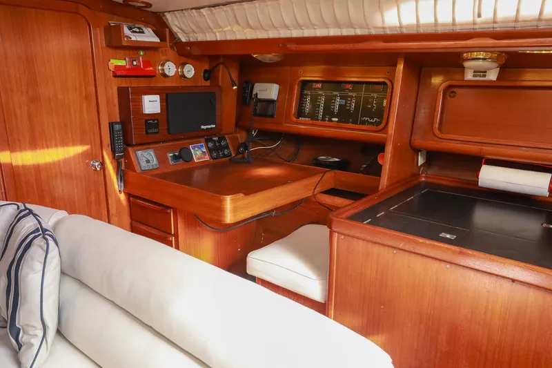 Slide: The Image of Interior of 1988 Grand Soleil 46 Jezequel yacht, featuring a wooden galley with stove and sink. - 15
