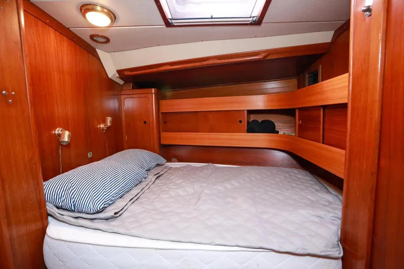 Slide: The Image of Cozy cabin interior of 1988 Grand Soleil 46 Jezequel sailboat with green bedding. - 21
