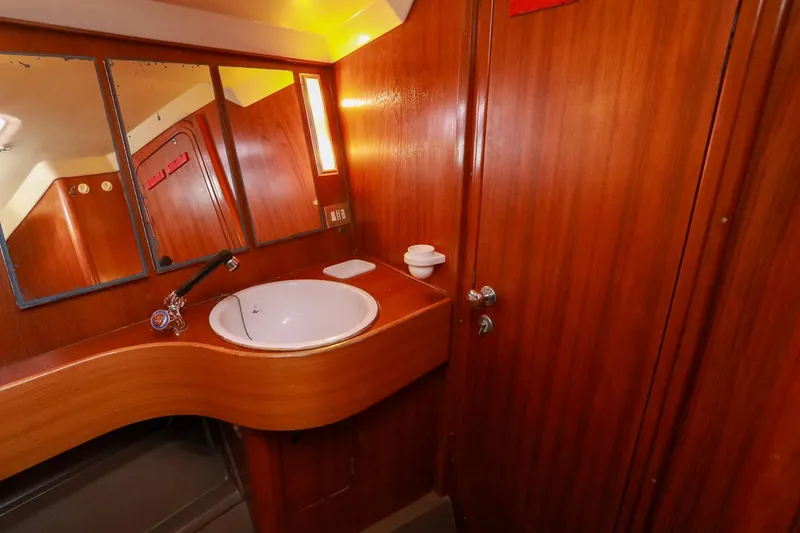 Slide: The Image of Cozy wooden interior of 1988 Grand Soleil 46 Jezequel yacht cabin with cushioned seating. - 23