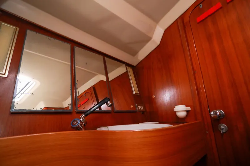 Slide: The Image of Wooden bathroom interior of 1988 Grand Soleil 46 Jezequel yacht with sink and mirror. - 24