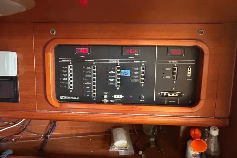 Slide: The Image of Control panel of a 1988 Grand Soleil 46 Jezequel yacht, featuring switches and displays. - 33