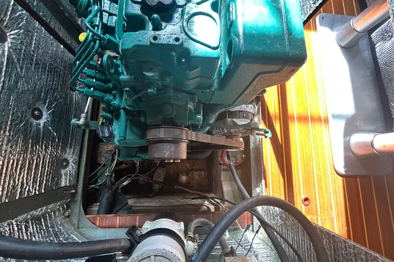 Slide: The Image of Engine compartment of 1988 Grand Soleil 46 Jezequel sailboat with visible machinery and components. - 43
