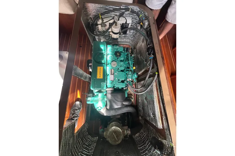 Slide: The Image of Engine compartment of 1988 Grand Soleil 46 Jezequel sailboat, showcasing detailed mechanical components. - 44