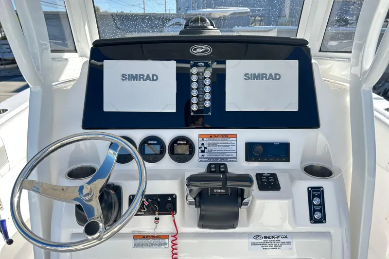 Slide: The Image of 2024 Sea Fox 268 Commander dashboard with Simrad displays and Yamaha controls. - 12