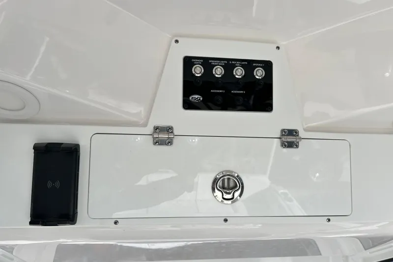 Slide: The Image of Control panel of 2024 Sea Fox 268 Commander boat with switches and storage compartment. - 18