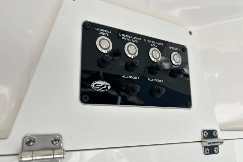 Slide: The Image of Control panel on 2024 Sea Fox 268 Commander boat, featuring various light and accessory switches. - 19