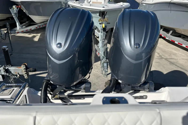 Slide: The Image of Twin outboard engines on a 2024 Sea Fox 268 Commander boat, parked on a trailer. - 20