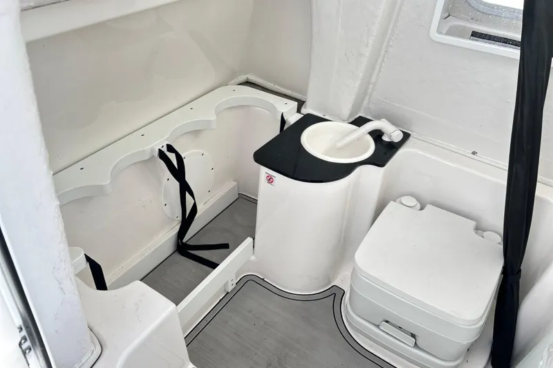 Slide: The Image of 2024 Sea Fox 268 Commander boat interior with compact sink and toilet. - 22