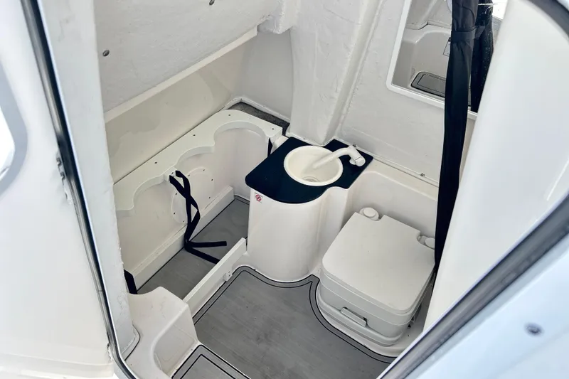 Slide: The Image of 2024 Sea Fox 268 Commander boat interior with compact bathroom amenities. - 23