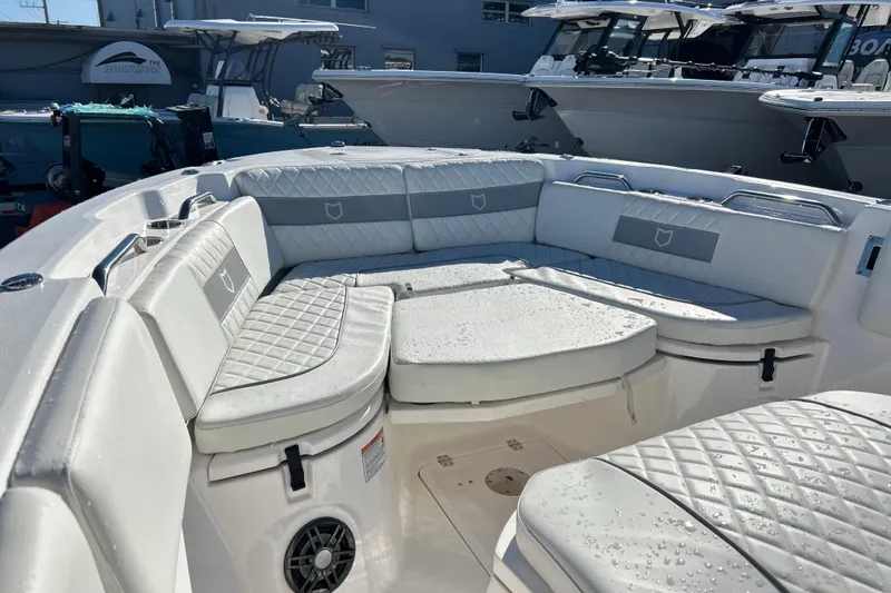 Slide: The Image of 2024 Sea Fox 268 Commander boat interior with cushioned seating and wet surfaces. - 4