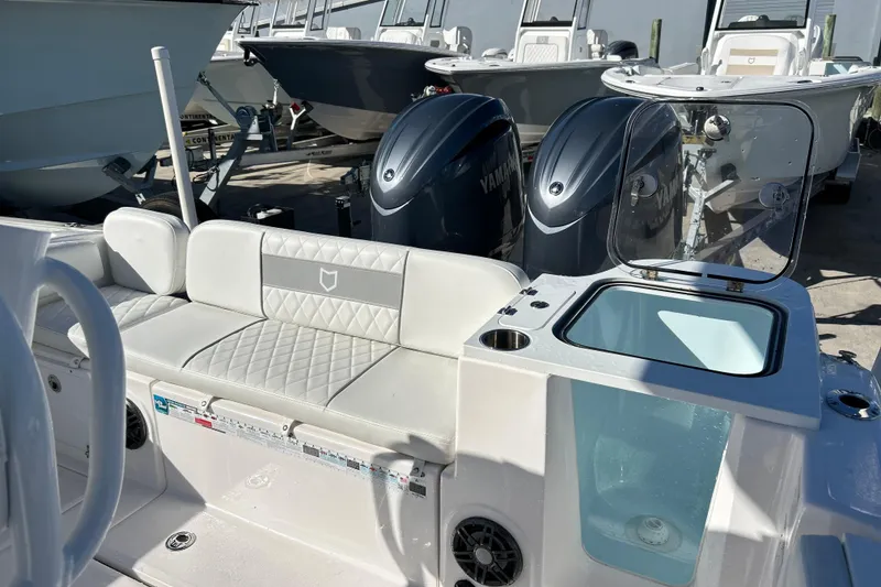 Slide: The Image of 2024 Sea Fox 268 Commander boat interior with seating and Yamaha engines. - 7