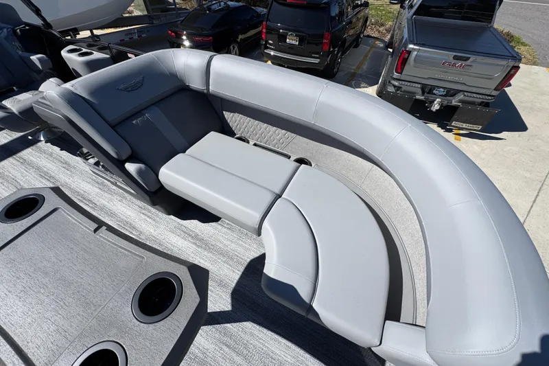 Slide: The Image of 2026 Bennington 22 MSB boat interior with gray seating and cup holders. - 18