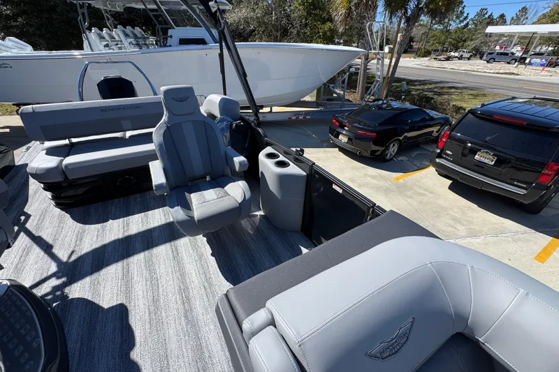 Slide: The Image of 2026 Bennington 22 MSB pontoon boat interior with gray seating and cup holders. - 20