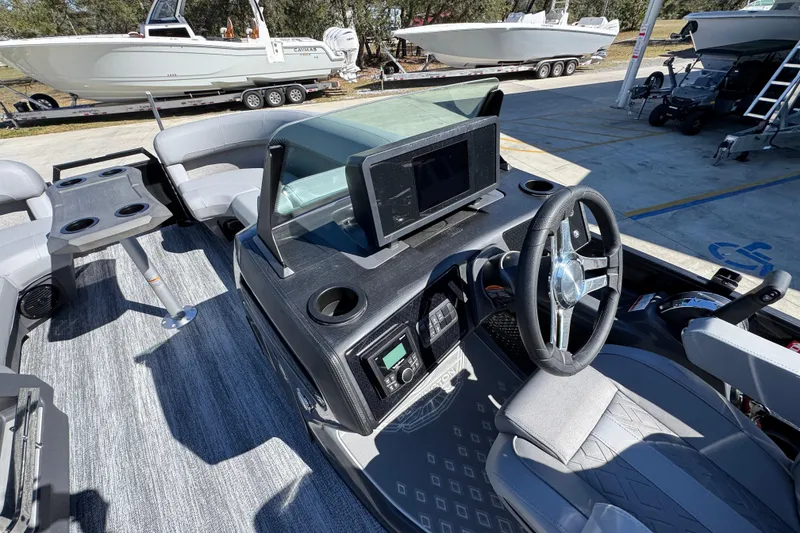 Slide: The Image of Interior of 2026 Bennington 22 MSB boat with modern helm and seating area. - 21