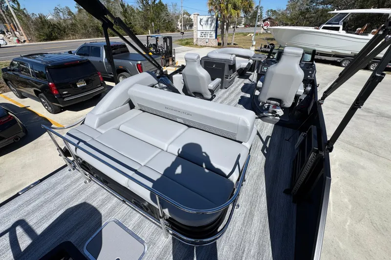 Slide: The Image of 2026 Bennington 22 MSB pontoon boat with sleek gray seating and modern design. - 29