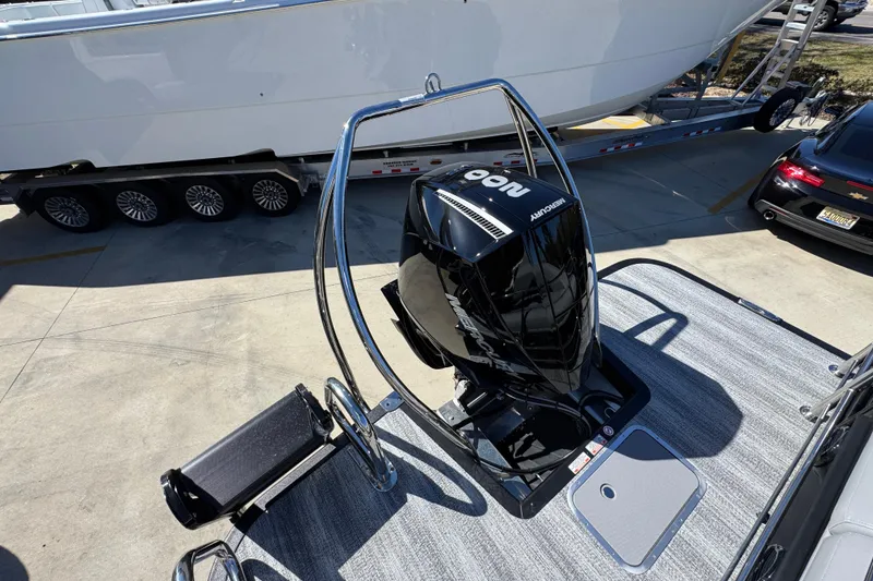 Slide: The Image of 2026 Bennington 22 MSB boat with Mercury outboard motor on trailer. - 32