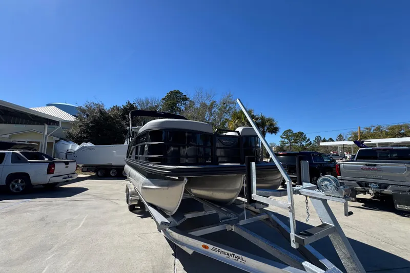 Slide: The Image of 2026 Bennington 22 MSB pontoon boat on trailer in sunny outdoor setting. - 6
